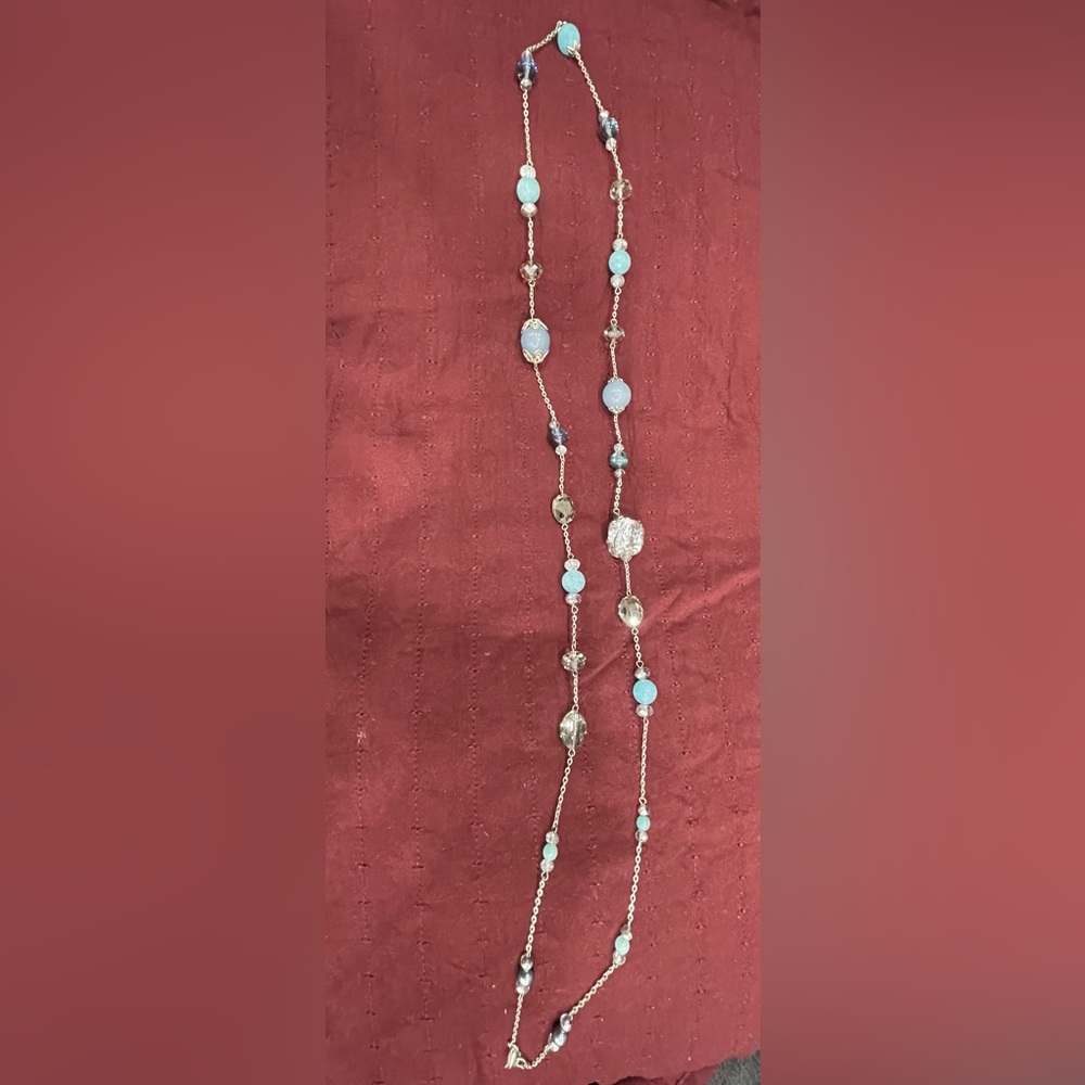 Silver 20” flapper style necklace with blue shaded beads. Can make shorter.